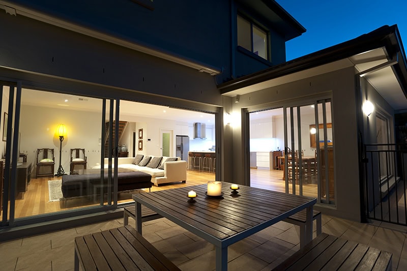 The Colorado Glow: Mastering Light and Heat for Cozy Fall Evenings. Indoor-outdoor living in the evening.